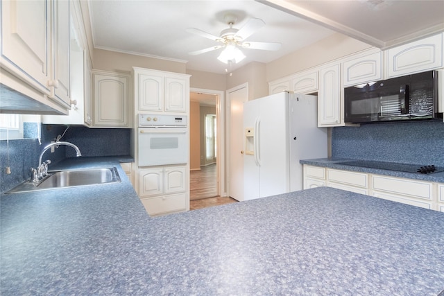 228 Hickory St, Huntsville, TX 77320 - kitchen with black appliances, a sink, ceiling fan, and tasteful backsplash