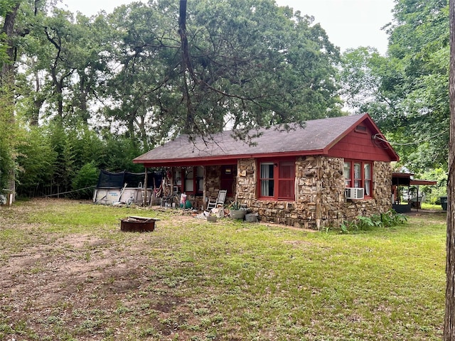 22606 Fm 359th Rd, Hempstead, TX 77445 - view of front of property with stone siding, a front lawn, and cooling unit
