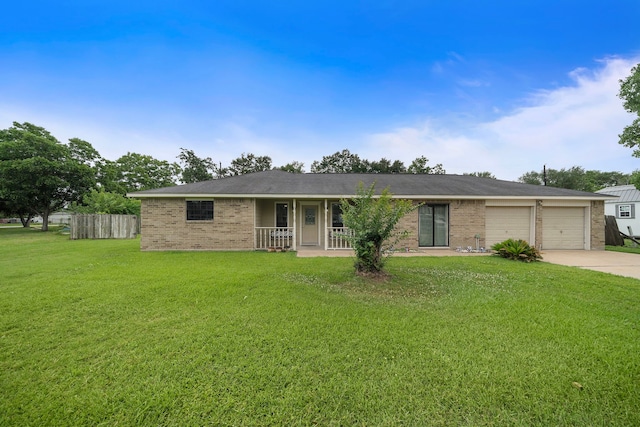 22307 Saddlewood Dr, Katy, TX 77449 - ranch-style house featuring concrete driveway, brick siding, a garage, and covered porch