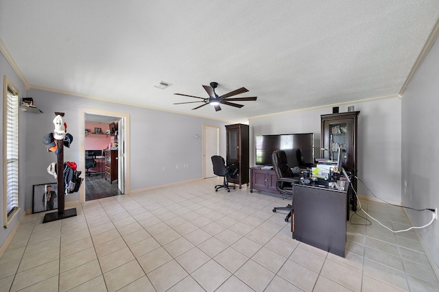 22307 Saddlewood Dr, Katy, TX 77449 - home office featuring ornamental molding, ceiling fan, light tile patterned floors, baseboards, and a textured ceiling