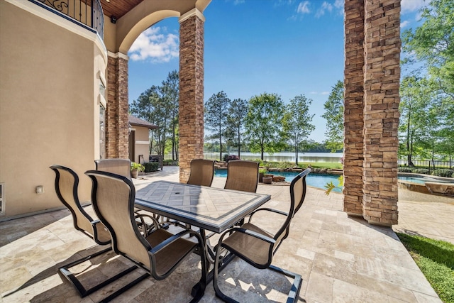 27521 Velvet Sky Way, Spring, TX 77386 - view of patio featuring a water view, outdoor dining space, and an outdoor hot tub