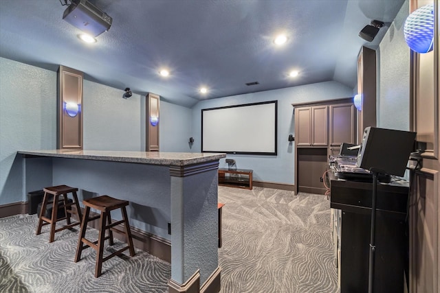 27521 Velvet Sky Way, Spring, TX 77386 - home theater with light carpet, lofted ceiling, baseboards, recessed lighting, and a textured wall