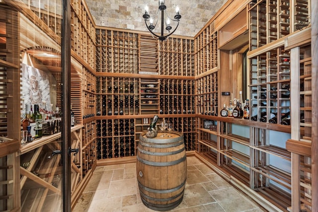 27521 Velvet Sky Way, Spring, TX 77386 - wine area featuring stone tile floors and a chandelier