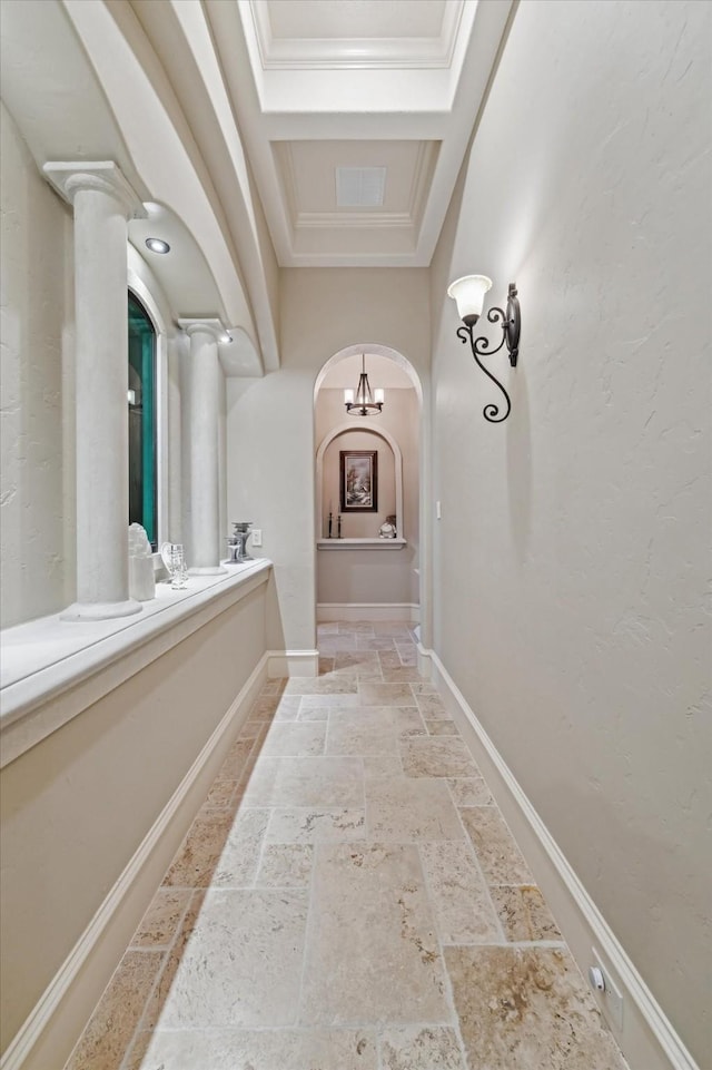 27521 Velvet Sky Way, Spring, TX 77386 - hall featuring stone tile floors, arched walkways, ornamental molding, baseboards, and a tray ceiling