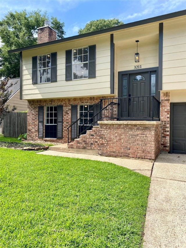 3211 Park Garden Dr, Houston, TX 77339 - raised ranch with brick siding and a chimney