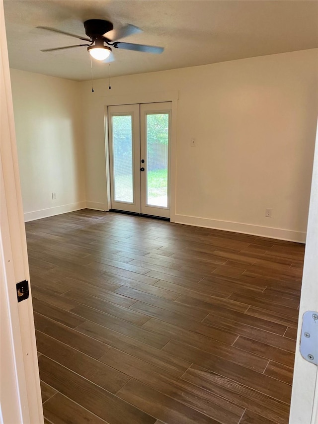 3211 Park Garden Dr, Houston, TX 77339 - empty room featuring french doors, ceiling fan, dark wood-style flooring, and baseboards