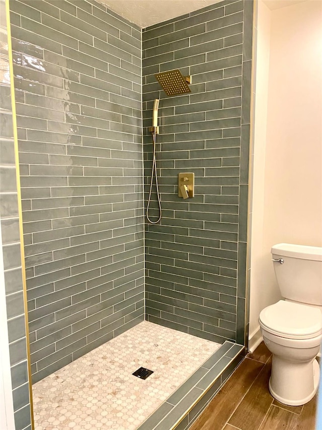 3211 Park Garden Dr, Houston, TX 77339 - full bathroom with toilet, a stall shower, and wood finished floors