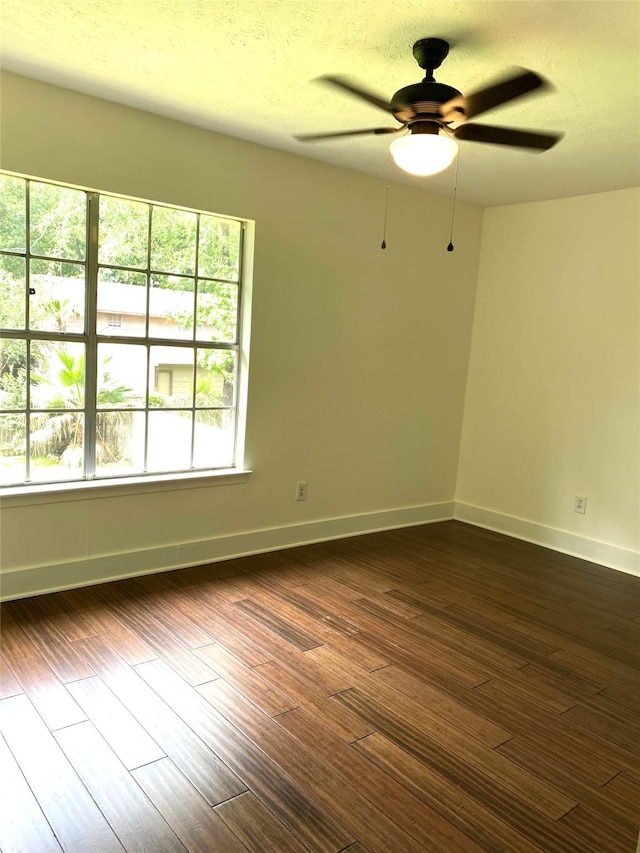 3211 Park Garden Dr, Houston, TX 77339 - empty room with ceiling fan, baseboards, and dark wood finished floors