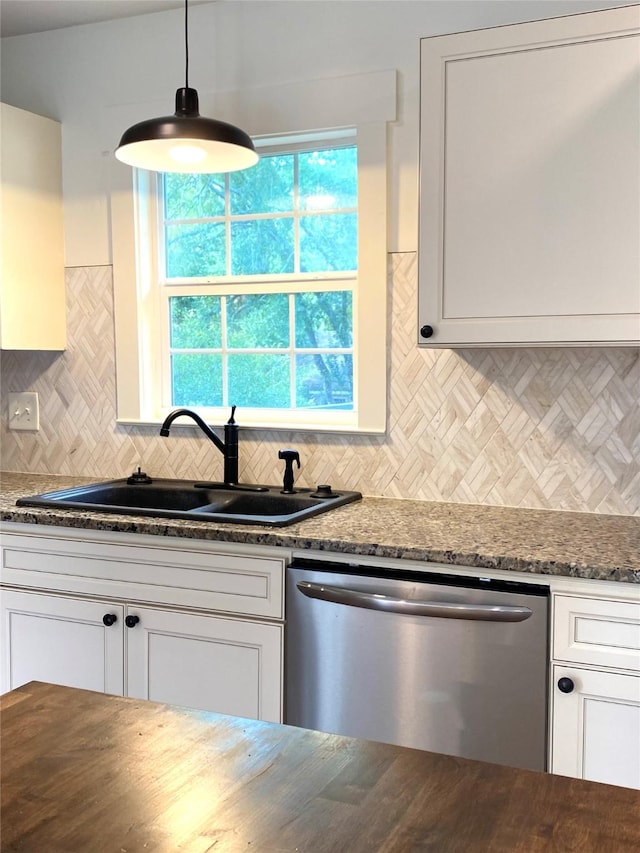 3211 Park Garden Dr, Houston, TX 77339 - kitchen featuring stainless steel dishwasher, a sink, tasteful backsplash, white cabinets, and dark stone counters