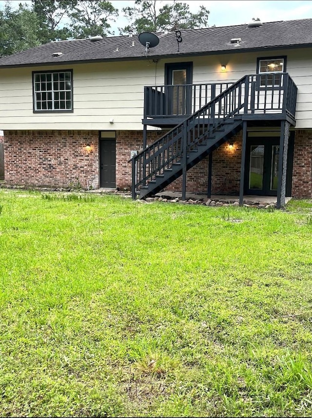 3211 Park Garden Dr, Houston, TX 77339 - rear view of house featuring stairway, brick siding, a lawn, and a deck