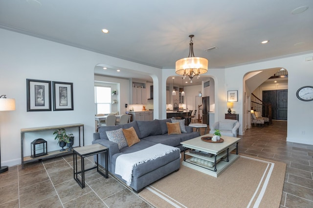 7 Fort Graham Ct, Missouri City, TX 77459 - living area featuring arched walkways, stairway, recessed lighting, and baseboards