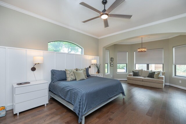 7 Fort Graham Ct, Missouri City, TX 77459 - bedroom featuring arched walkways, ornamental molding, wood finished floors, ceiling fan, and a decorative wall