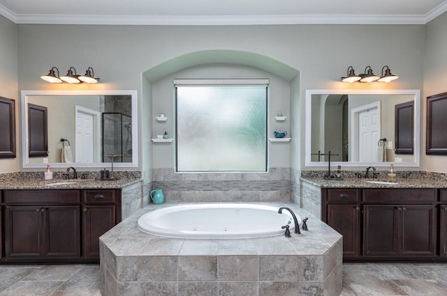 7 Fort Graham Ct, Missouri City, TX 77459 - bathroom with a whirlpool tub, two vanities, ornamental molding, and a shower stall