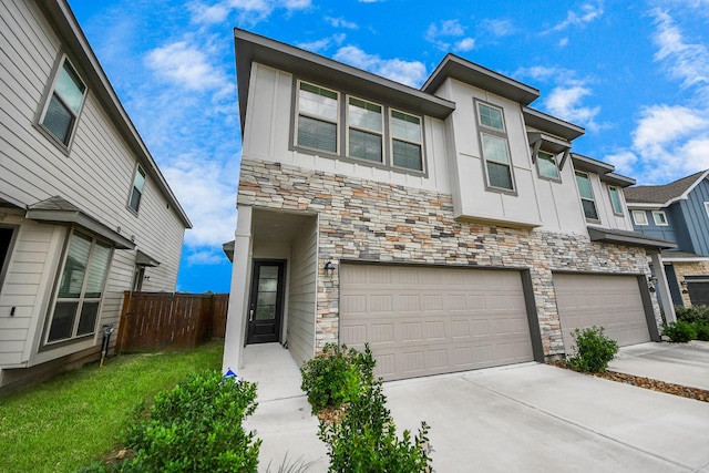 4214 Balboa Dr, Iowa Colony, TX 77583 - view of front of home with stone siding, board and batten siding, concrete driveway, and a garage
