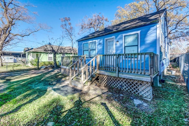 2416 Eastman St, Houston, TX 77009 - rear view of house with a deck and a shingled roof