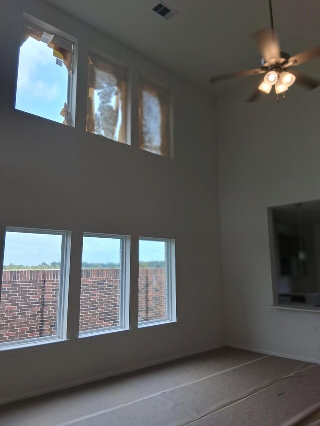 3603 Crosspointe Pass, Angleton, TX 77515 - interior space with ceiling fan and stucco siding