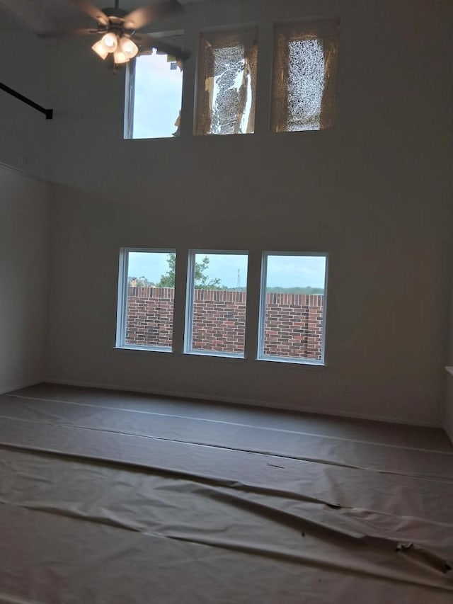 3603 Crosspointe Pass, Angleton, TX 77515 - empty room with plenty of natural light and a ceiling fan