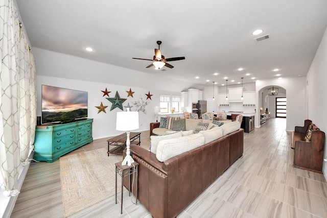 1311 Hudgins Pass, Richmond, TX 77469 - living room featuring arched walkways, a ceiling fan, and recessed lighting