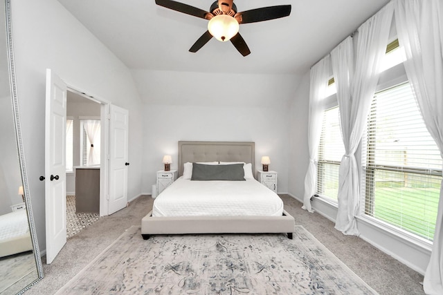 1311 Hudgins Pass, Richmond, TX 77469 - bedroom featuring light carpet, multiple windows, vaulted ceiling, and baseboards