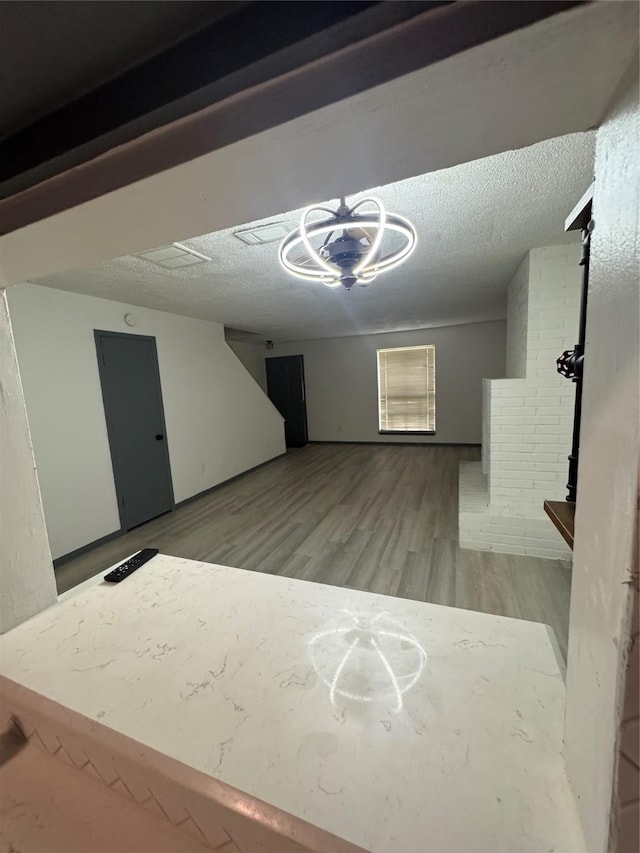 355 Audrey Ln Unit 355, Houston, TX 77015 - below grade area with wood finished floors and a textured ceiling