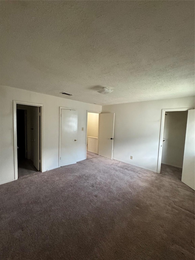 355 Audrey Ln Unit 355, Houston, TX 77015 - unfurnished bedroom with a textured ceiling and carpet
