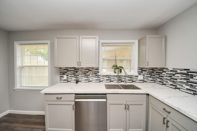 3111 Tanglebriar Dr, Pasadena, TX 77503 - kitchen featuring stainless steel dishwasher, a sink, backsplash, baseboards, and dark wood finished floors