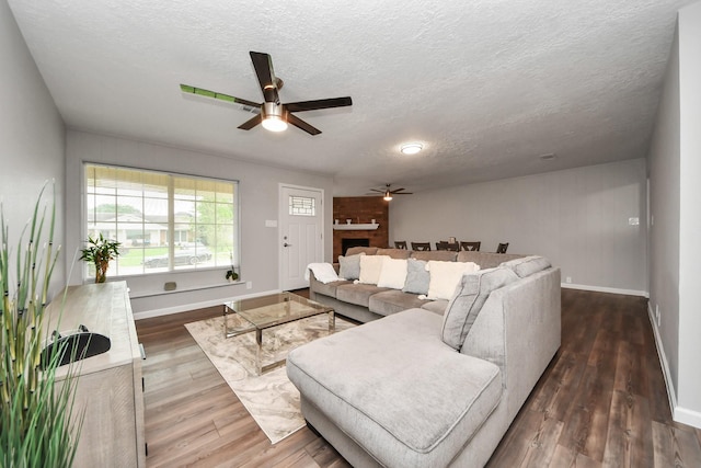 3111 Tanglebriar Dr, Pasadena, TX 77503 - living area with a ceiling fan, baseboards, wood finished floors, and a textured ceiling