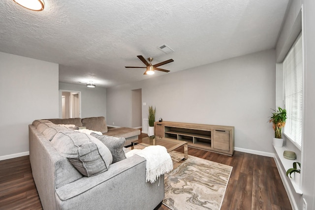 3111 Tanglebriar Dr, Pasadena, TX 77503 - living area featuring baseboards, a ceiling fan, wood finished floors, and a textured ceiling