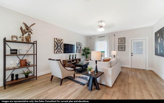 3644 Crosspointe Pass, Angleton, TX 77515 - living area featuring wood finished floors and baseboards