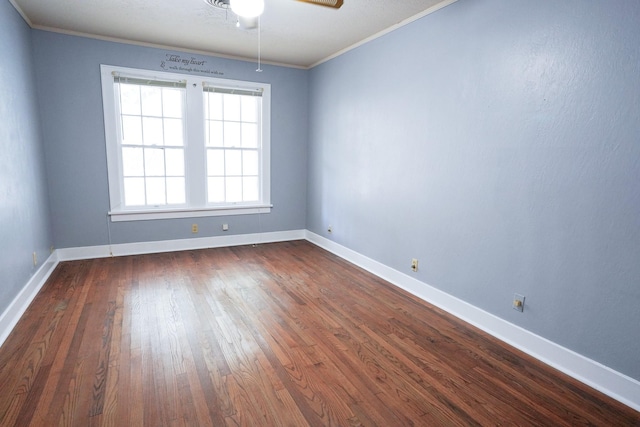 1514 Laurel St, La Marque, TX 77568 - empty room with a ceiling fan, ornamental molding, dark wood finished floors, and baseboards