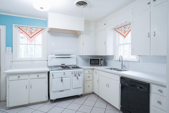 1514 Laurel St, La Marque, TX 77568 - kitchen featuring dishwasher, stainless steel microwave, white range with gas stovetop, a sink, and crown molding
