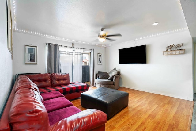 3015 Walnut Bend Ln Unit 37, Houston, TX 77042 - living area with ceiling fan, wood finished floors, and baseboards