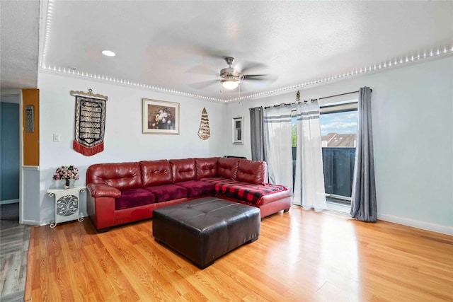 3015 Walnut Bend Ln Unit 37, Houston, TX 77042 - living room featuring ceiling fan, wood finished floors, baseboards, and a textured ceiling