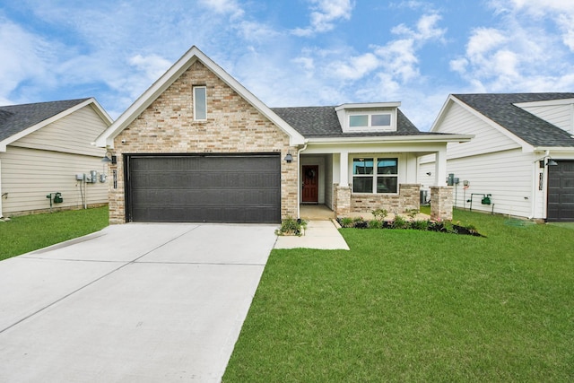 31811 Whittis Hill Way, Fulshear, TX 77441 - craftsman-style home featuring driveway, an attached garage, brick siding, a front lawn, and roof with shingles