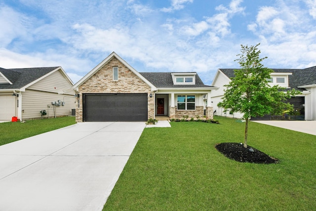 31811 Whittis Hill Way, Fulshear, TX 77441 - view of front of property with driveway, a front lawn, stone siding, an attached garage, and a shingled roof