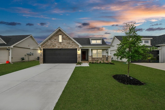 31811 Whittis Hill Way, Fulshear, TX 77441 - view of front of house with concrete driveway, an attached garage, a front lawn, stone siding, and roof with shingles