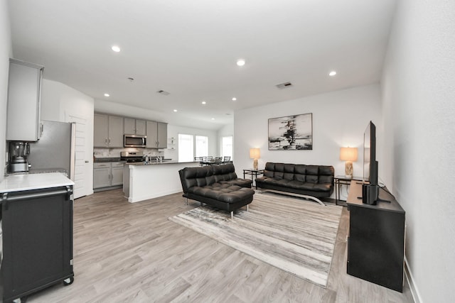 31811 Whittis Hill Way, Fulshear, TX 77441 - living room featuring light wood-type flooring, recessed lighting, and baseboards