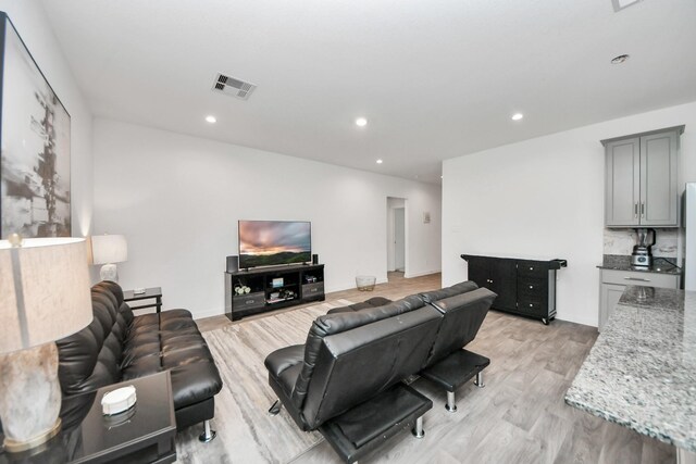 31811 Whittis Hill Way, Fulshear, TX 77441 - living area featuring light wood-style flooring and recessed lighting
