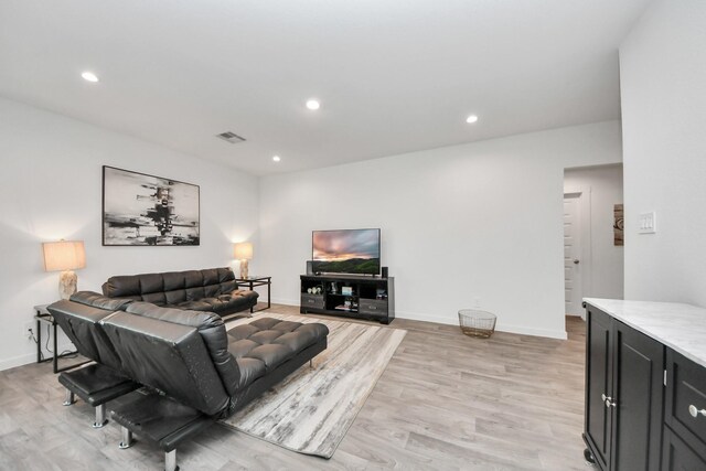 31811 Whittis Hill Way, Fulshear, TX 77441 - living area featuring light wood finished floors, recessed lighting, and baseboards