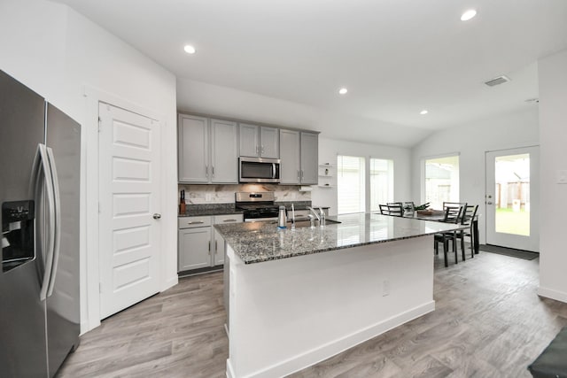 31811 Whittis Hill Way, Fulshear, TX 77441 - kitchen featuring appliances with stainless steel finishes, gray cabinets, a sink, light wood finished floors, and recessed lighting