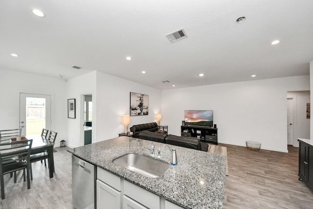 31811 Whittis Hill Way, Fulshear, TX 77441 - kitchen with a sink, dishwasher, light stone counters, light wood-type flooring, and recessed lighting