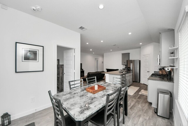 31811 Whittis Hill Way, Fulshear, TX 77441 - dining area featuring light wood finished floors, recessed lighting, and baseboards