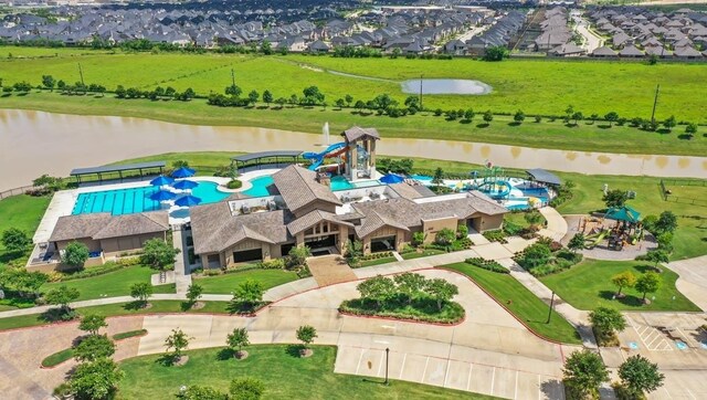 31811 Whittis Hill Way, Fulshear, TX 77441 - drone / aerial view of a pool and a nearby body of water