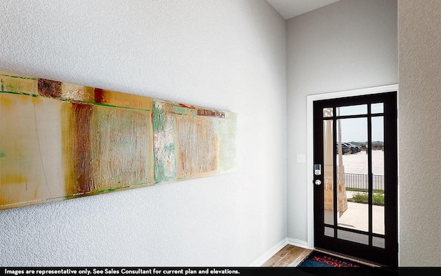 1726 Navigation Ln, Angleton, TX 77515 - foyer featuring wood finished floors, baseboards, and a textured wall