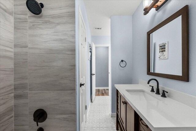 12153 24th St, Santa Fe, TX 77510 - full bath with a shower, vanity, and tile patterned flooring