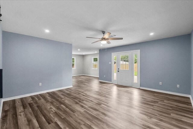 12153 24th St, Santa Fe, TX 77510 - unfurnished living room with recessed lighting, ceiling fan, wood finished floors, and baseboards