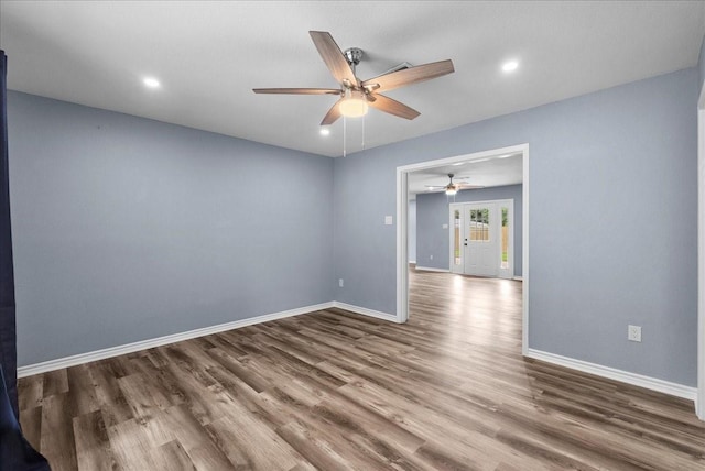 12153 24th St, Santa Fe, TX 77510 - empty room with a ceiling fan, wood finished floors, baseboards, and recessed lighting