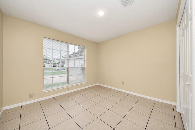 210 Squires Bnd, Stafford, TX 77477 - unfurnished room with light tile patterned floors, baseboards, and recessed lighting
