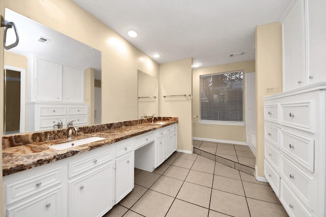 210 Squires Bnd, Stafford, TX 77477 - full bath featuring double vanity, tile patterned flooring, baseboards, and recessed lighting