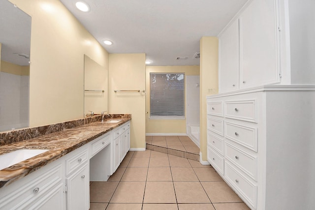 210 Squires Bnd, Stafford, TX 77477 - bathroom with double vanity, tile patterned floors, recessed lighting, and baseboards